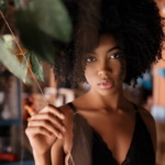 a woman with big curly hair